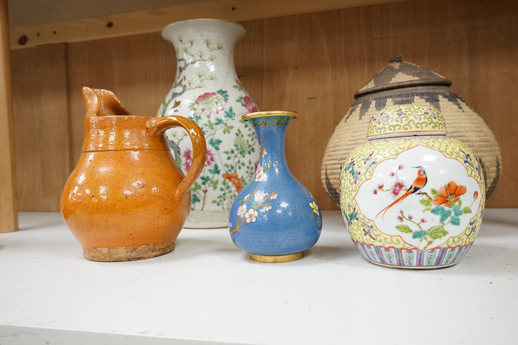 A mid 19th century Chinese famille rose vase together with other oriental and African wares, largest 33cm high. Condition - varies